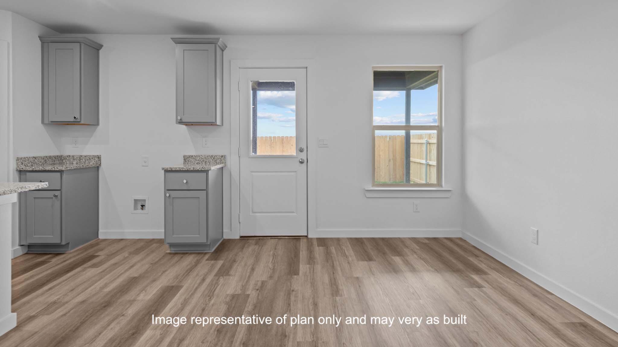 7444 9th Street Lubbock, TX 79416 - Photo 9 of 24 a view of a livingroom with wooden floor and a window