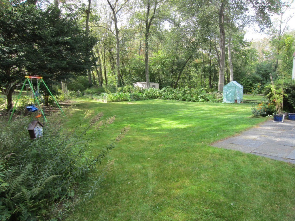 4 Milk Street Lexington, MA 02421 - Photo 11 of 11 a backyard of a house with lots of green space