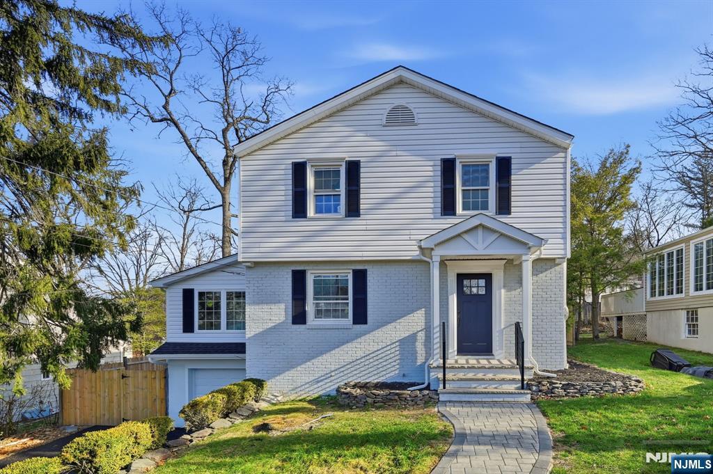 30 West Lawn Road Livingston, NJ 07039 - Photo 1 of 33 a front view of a house with a yard