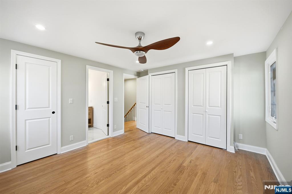 30 West Lawn Road Livingston, NJ 07039 - Photo 17 of 33 a view of a livingroom with a ceiling fan & entryway