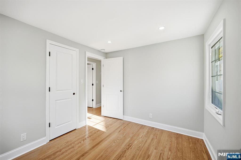 30 West Lawn Road Livingston, NJ 07039 - Photo 19 of 33 a view of an empty room with wooden floor