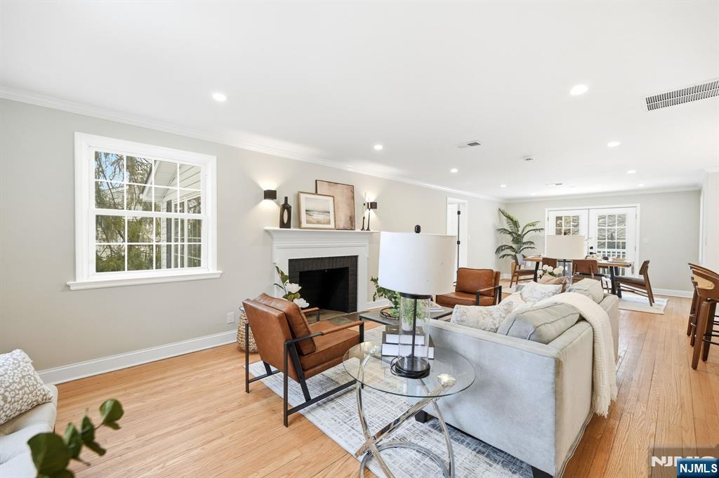 30 West Lawn Road Livingston, NJ 07039 - Photo 4 of 33 a living room with furniture a fireplace and a window