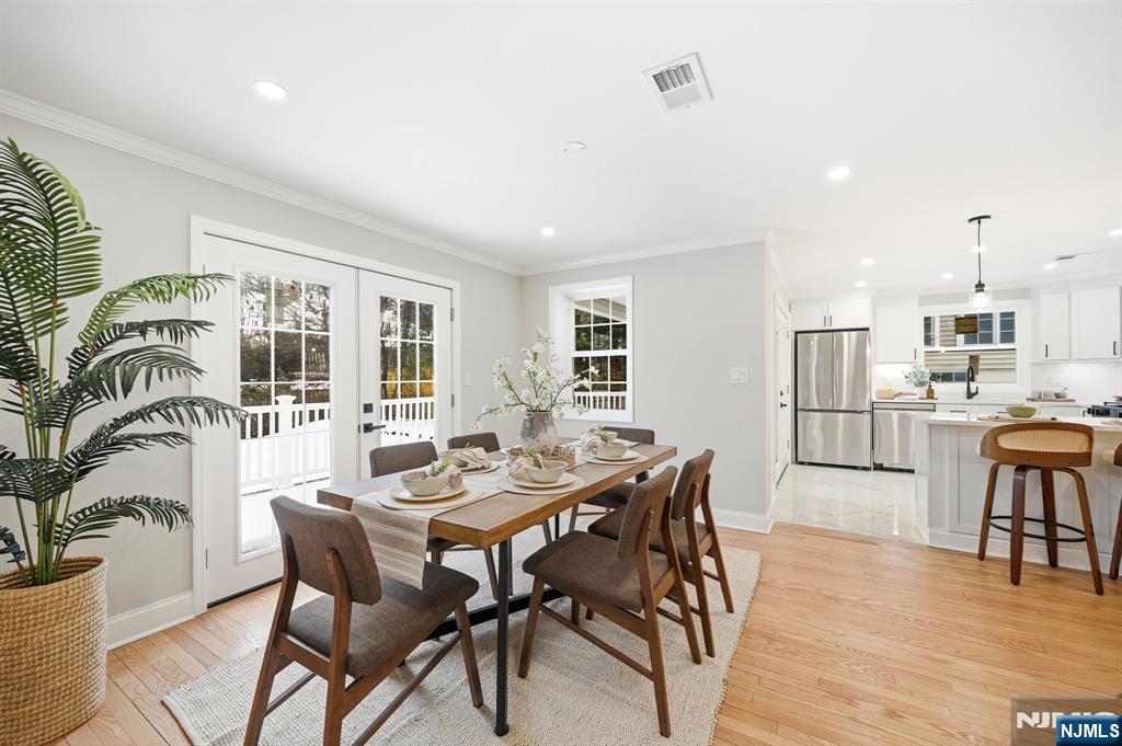30 West Lawn Road Livingston, NJ 07039 - Photo 9 of 33 a view of a dining room with furniture and wooden floor