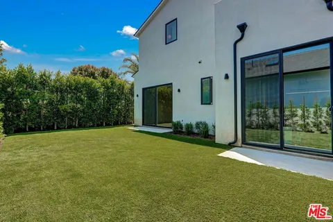 a view of a backyard of the house