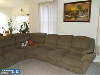 17 Johnson Road Lawrenceville, NJ 08648 - Photo 5 of 12 a living room with furniture and a couch