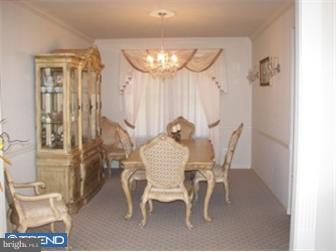 17 Johnson Road Lawrenceville, NJ 08648 - Photo 8 of 12 a view of a dining room with furniture and chandelier