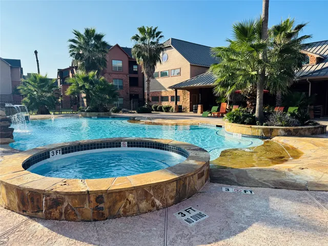 a view of swimming pool with outdoor seating