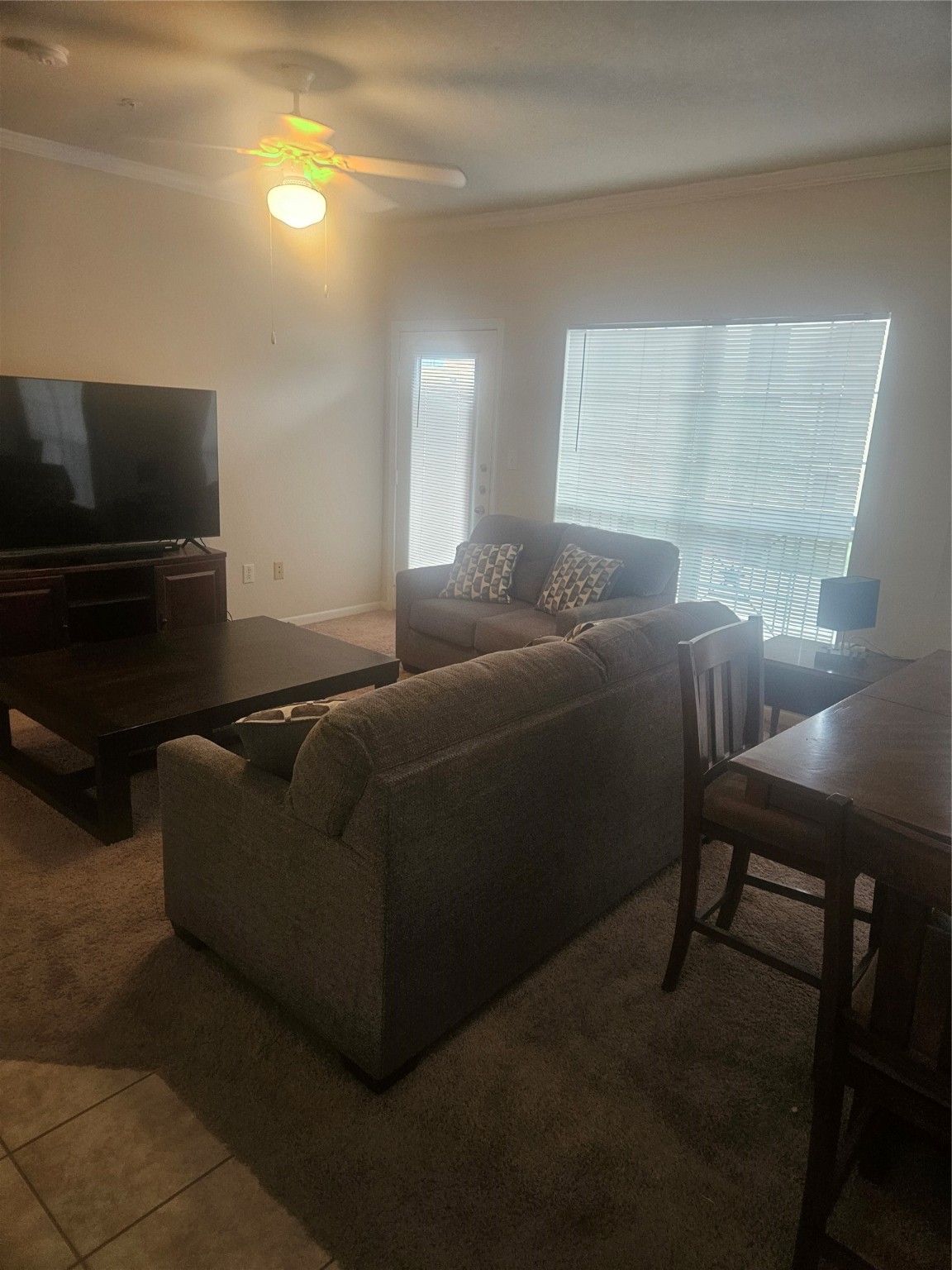 11144 Fuqua Street, Unit 923 Houston, TX 77089 - Photo 5 of 7 a living room with furniture and a flat screen tv