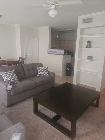a living room with furniture and a rug