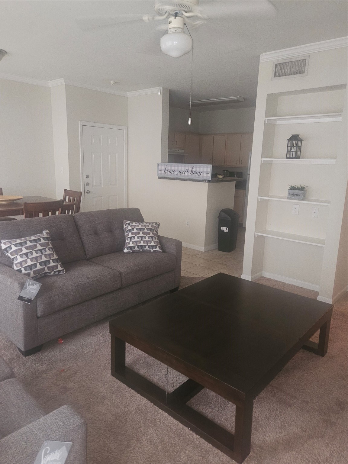 11144 Fuqua Street, Unit 923 Houston, TX 77089 - Photo 6 of 7 a living room with furniture and a rug