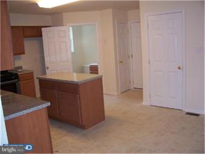 301 East Mill Road Maple Shade, NJ 08052 - Photo 6 of 10 a kitchen with a sink and cabinets