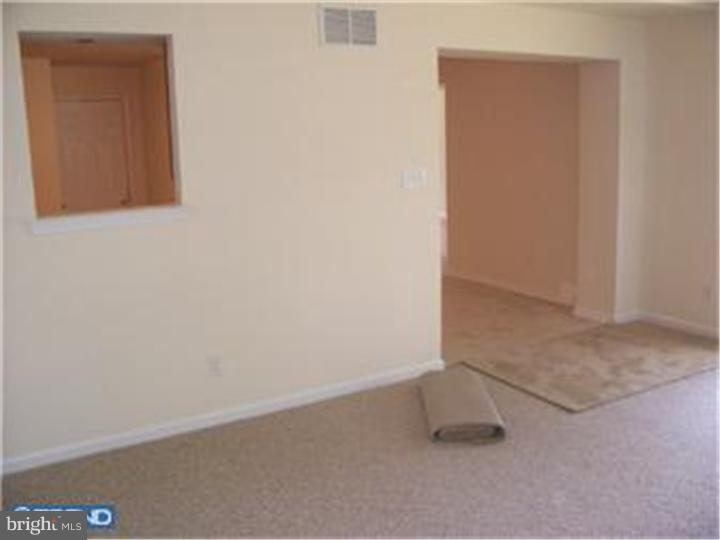 301 East Mill Road Maple Shade, NJ 08052 - Photo 8 of 10 an empty room with a bench