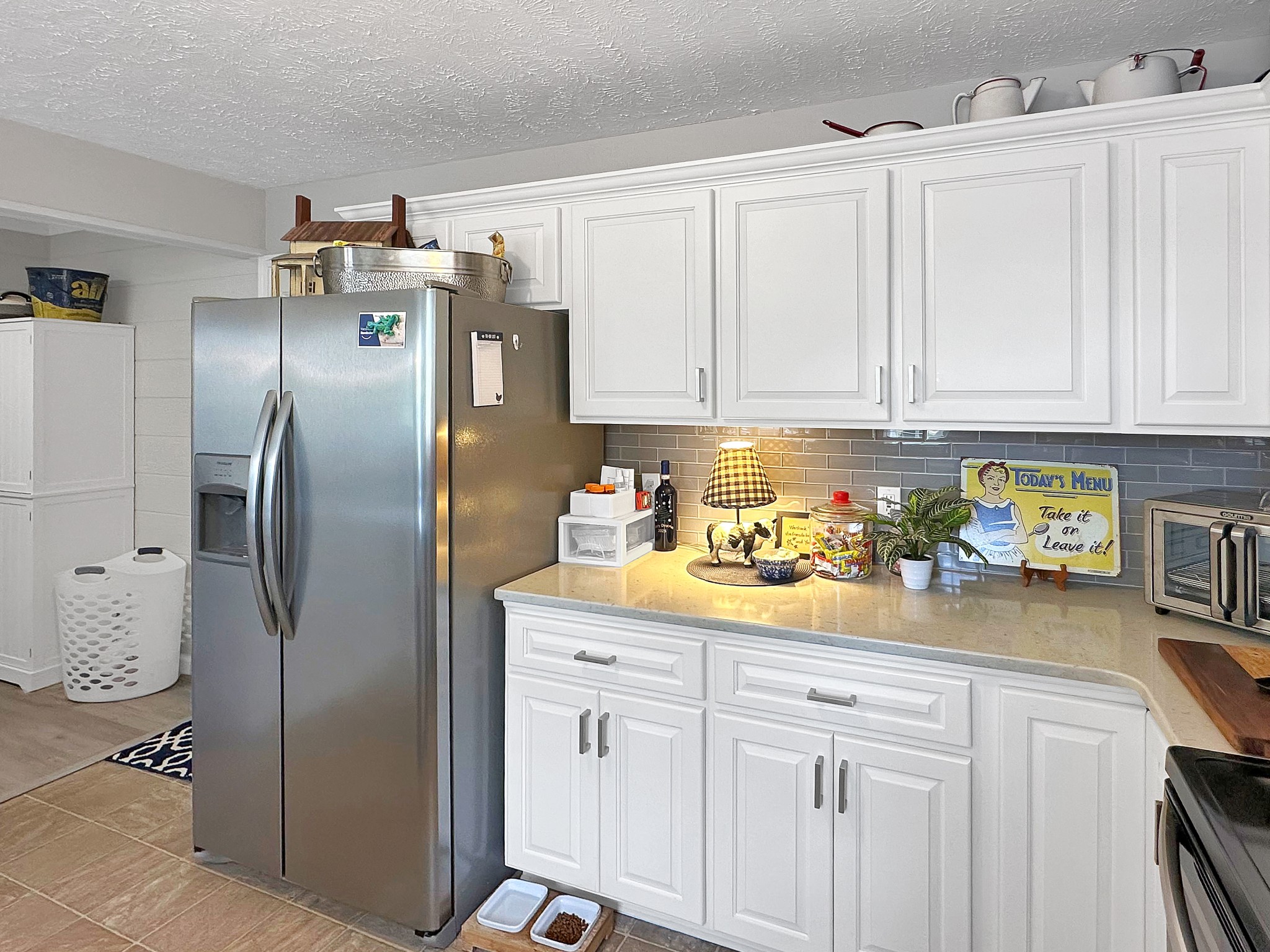 788 Van Dyke Grove Road Paris, TN 38242 - Photo 15 of 34 a kitchen with a refrigerator and cabinets
