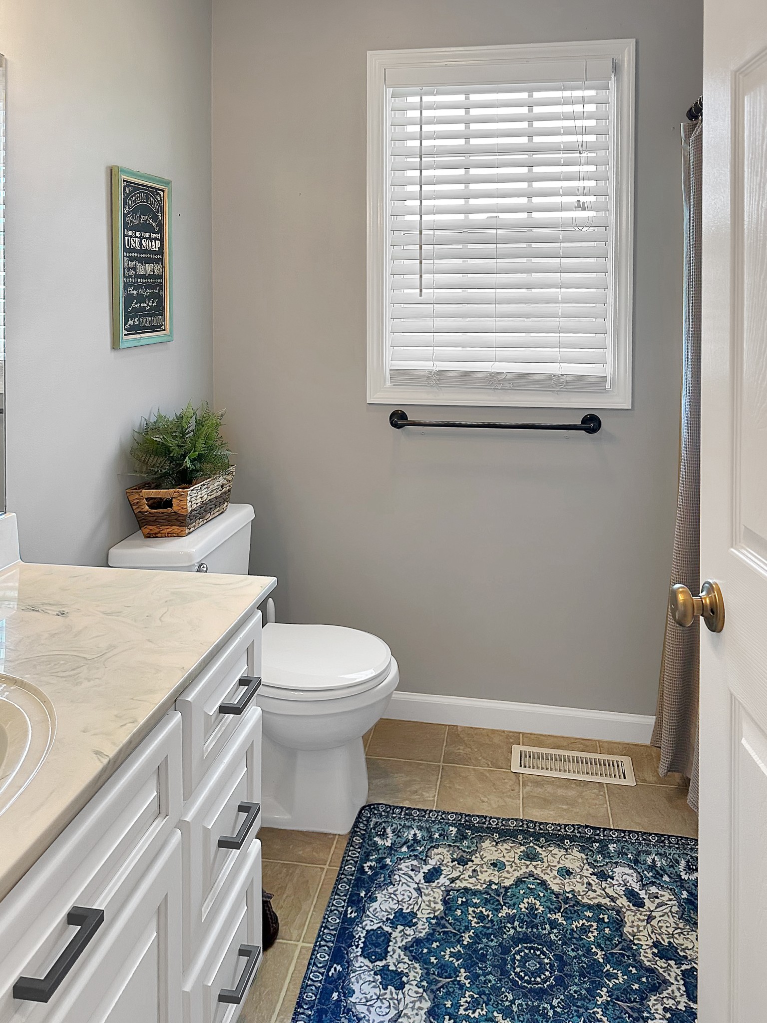 788 Van Dyke Grove Road Paris, TN 38242 - Photo 19 of 34 a bathroom with a toilet a sink and a window