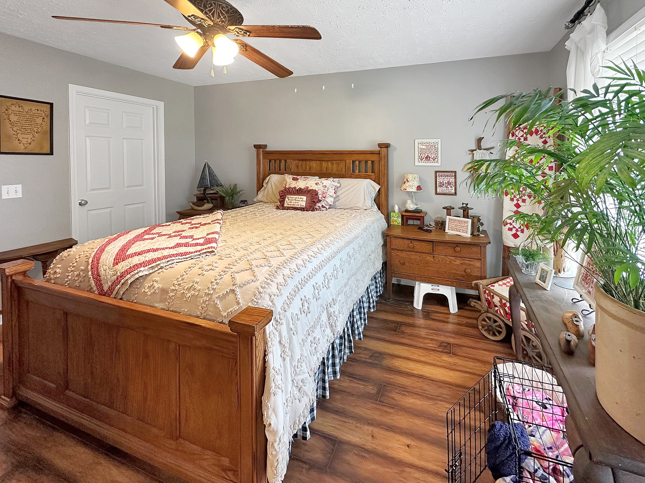 788 Van Dyke Grove Road Paris, TN 38242 - Photo 26 of 34 a bedroom with bed and a chandelier