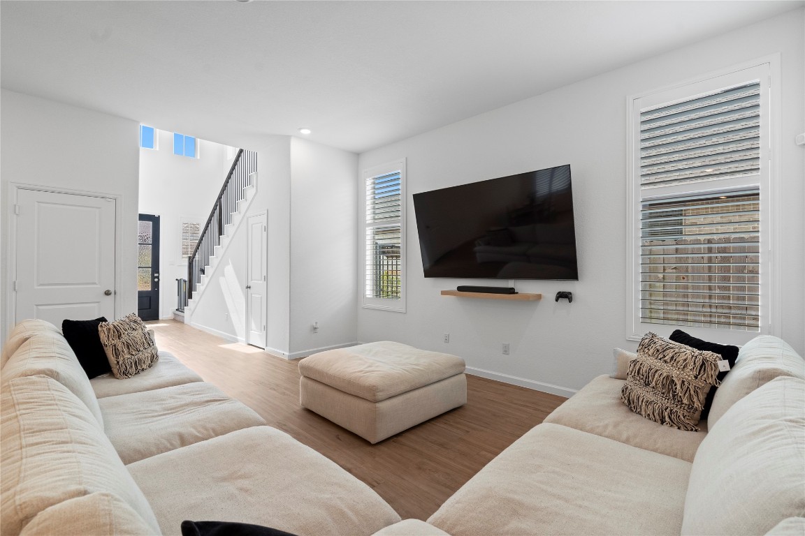 6025 Windward Fls Way Porter, TX 77365 - Photo 11 of 35 a living room with furniture and a flat screen tv