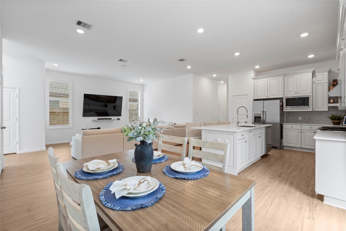 6025 Windward Fls Way Porter, TX 77365 - Photo 13 of 35 a open dining room with furniture wooden floor kitchen view and kitchen view