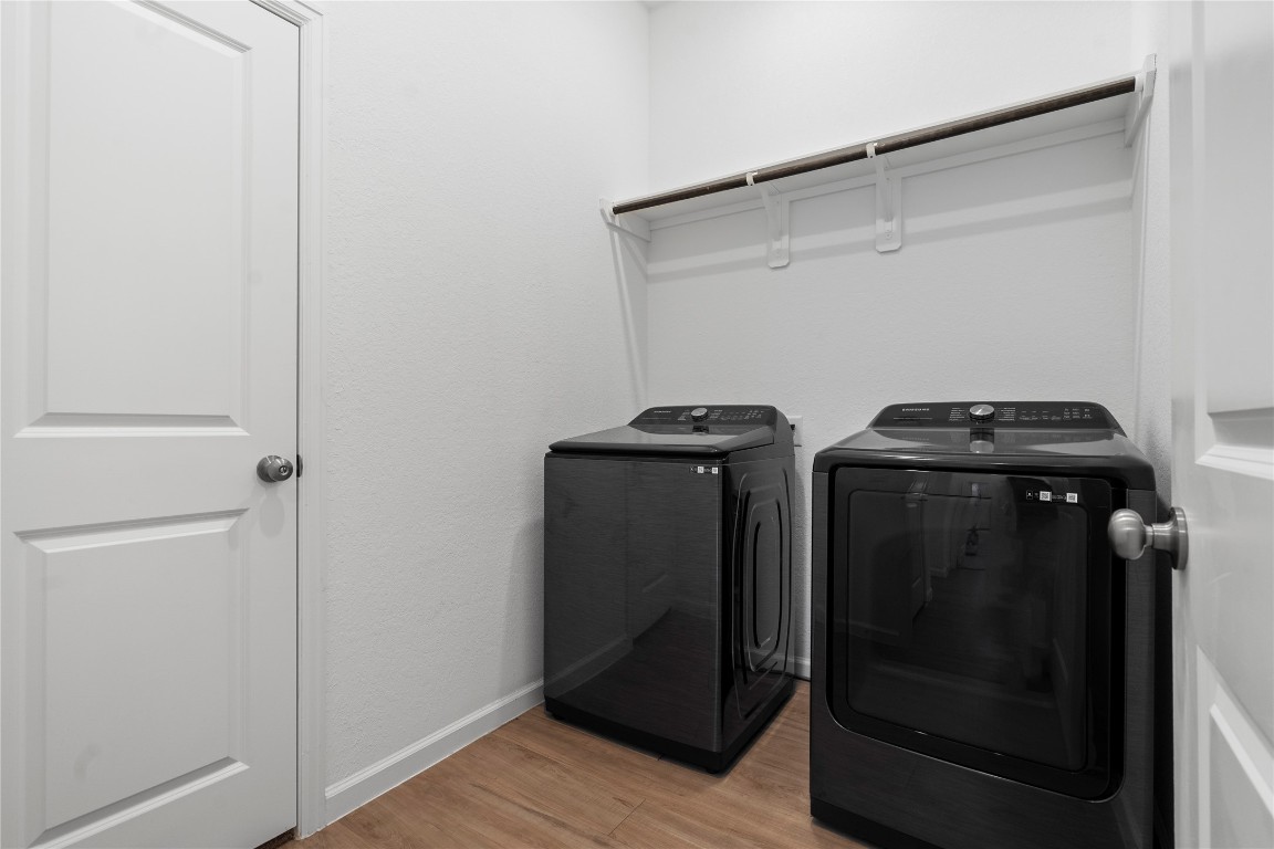 6025 Windward Fls Way Porter, TX 77365 - Photo 20 of 35 a utility room with wooden floor washer and dryer