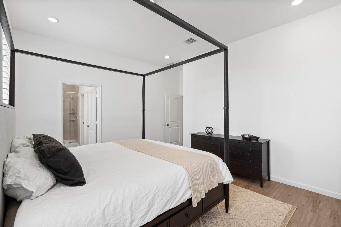 6025 Windward Fls Way Porter, TX 77365 - Photo 22 of 35 a bedroom with a bed and a television