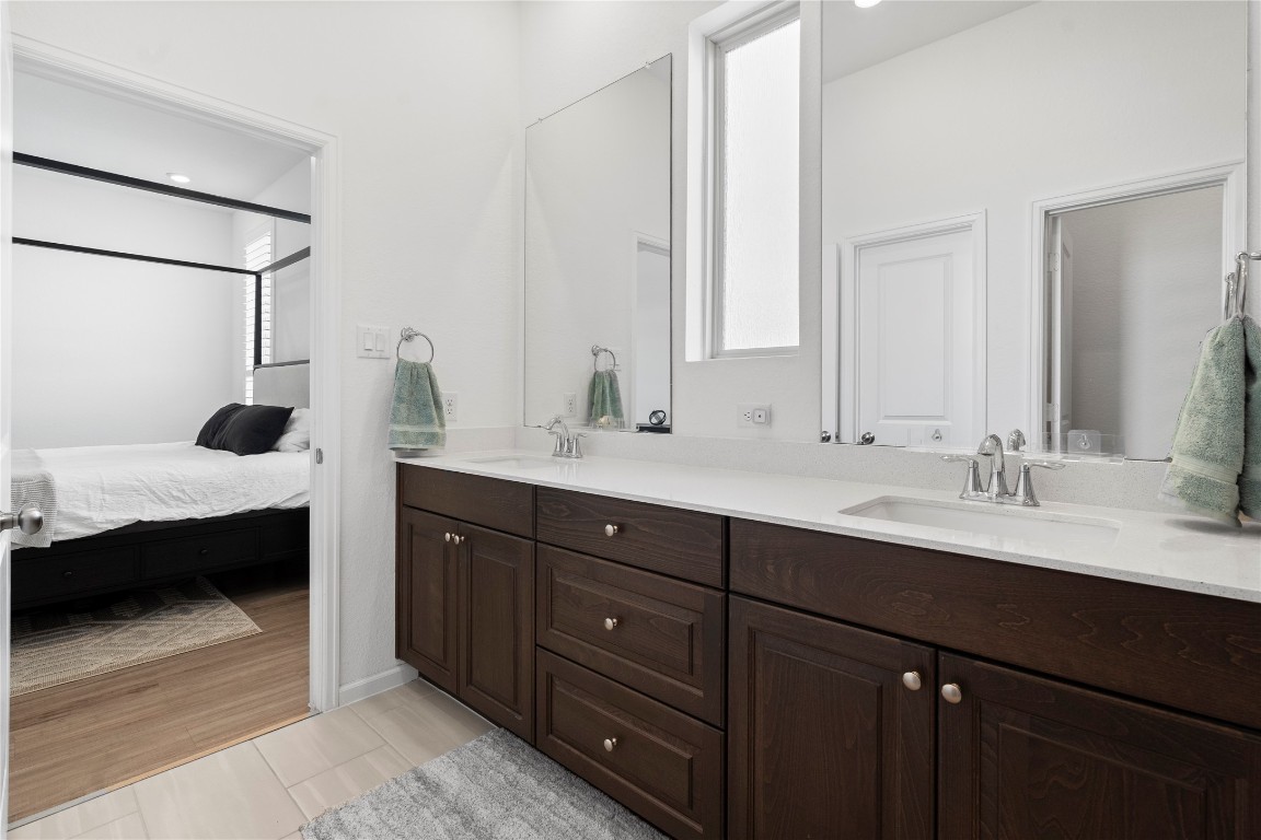 6025 Windward Fls Way Porter, TX 77365 - Photo 24 of 35 a en suite bathroom with double vanity and mirrors