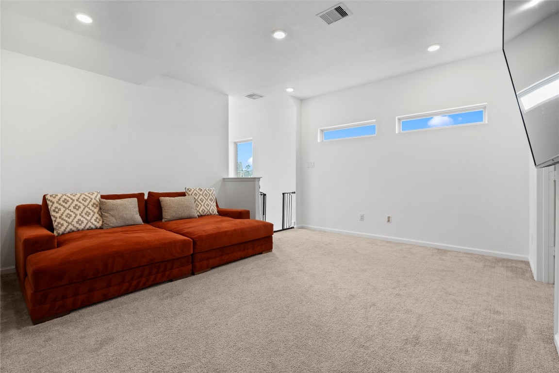 6025 Windward Fls Way Porter, TX 77365 - Photo 28 of 35 a living room with a couch and a ceiling fan