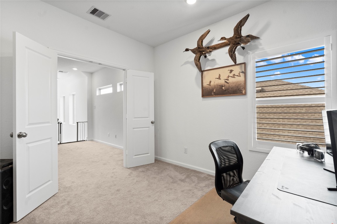 6025 Windward Fls Way Porter, TX 77365 - Photo 30 of 35 a view of a workspace with furniture and a window