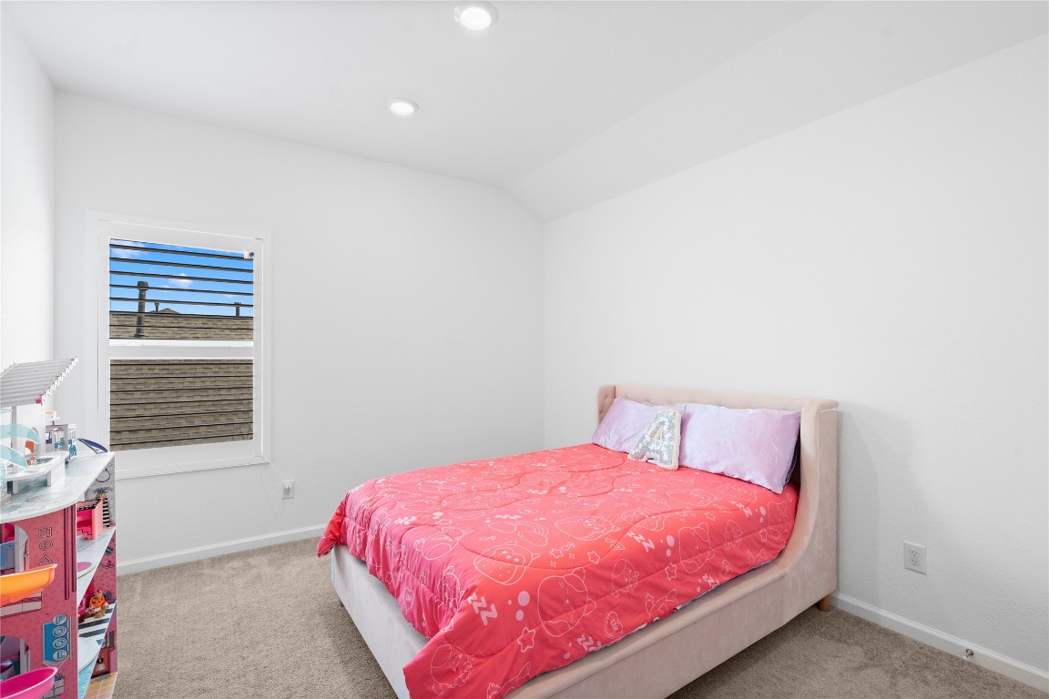 6025 Windward Fls Way Porter, TX 77365 - Photo 34 of 35 a bedroom with a bed and a window