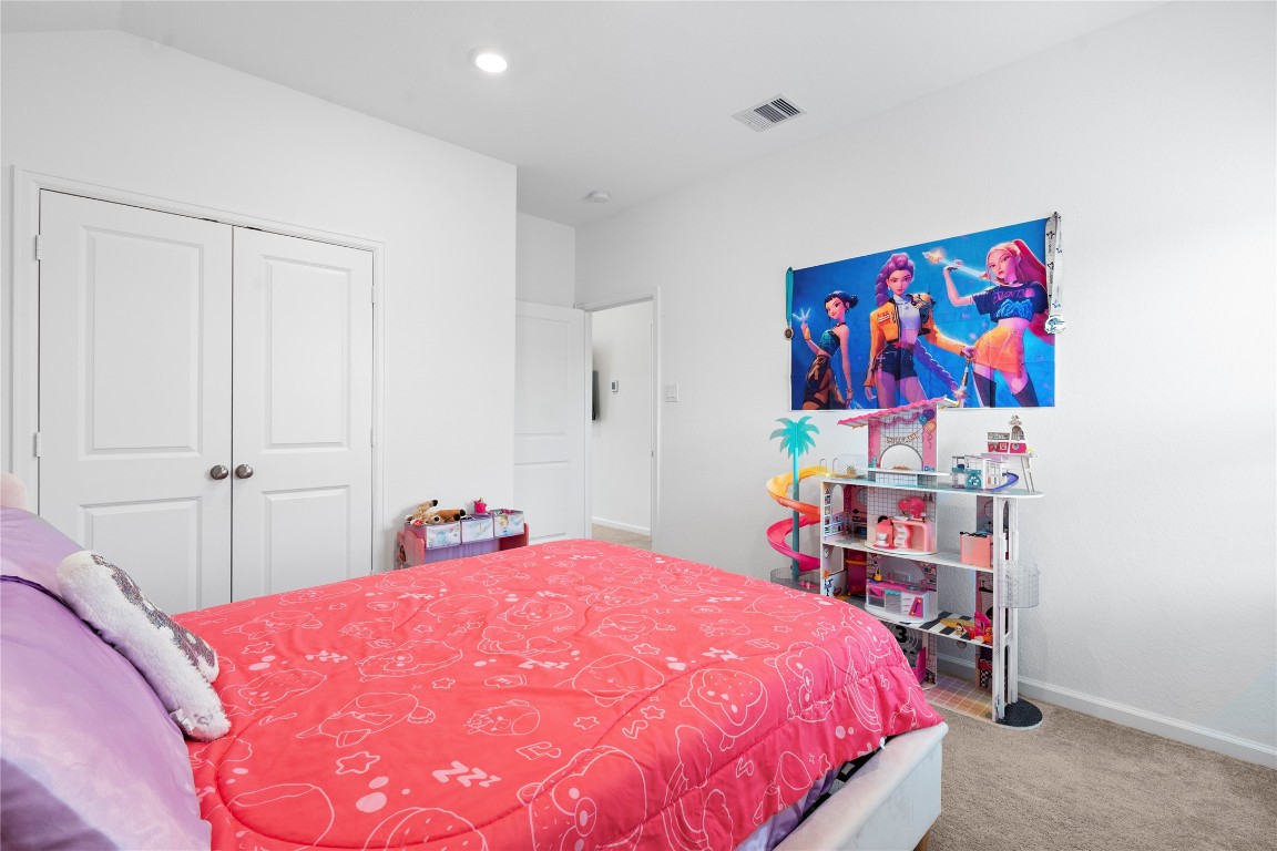 6025 Windward Fls Way Porter, TX 77365 - Photo 35 of 35 a bedroom with a bed and a book shelf