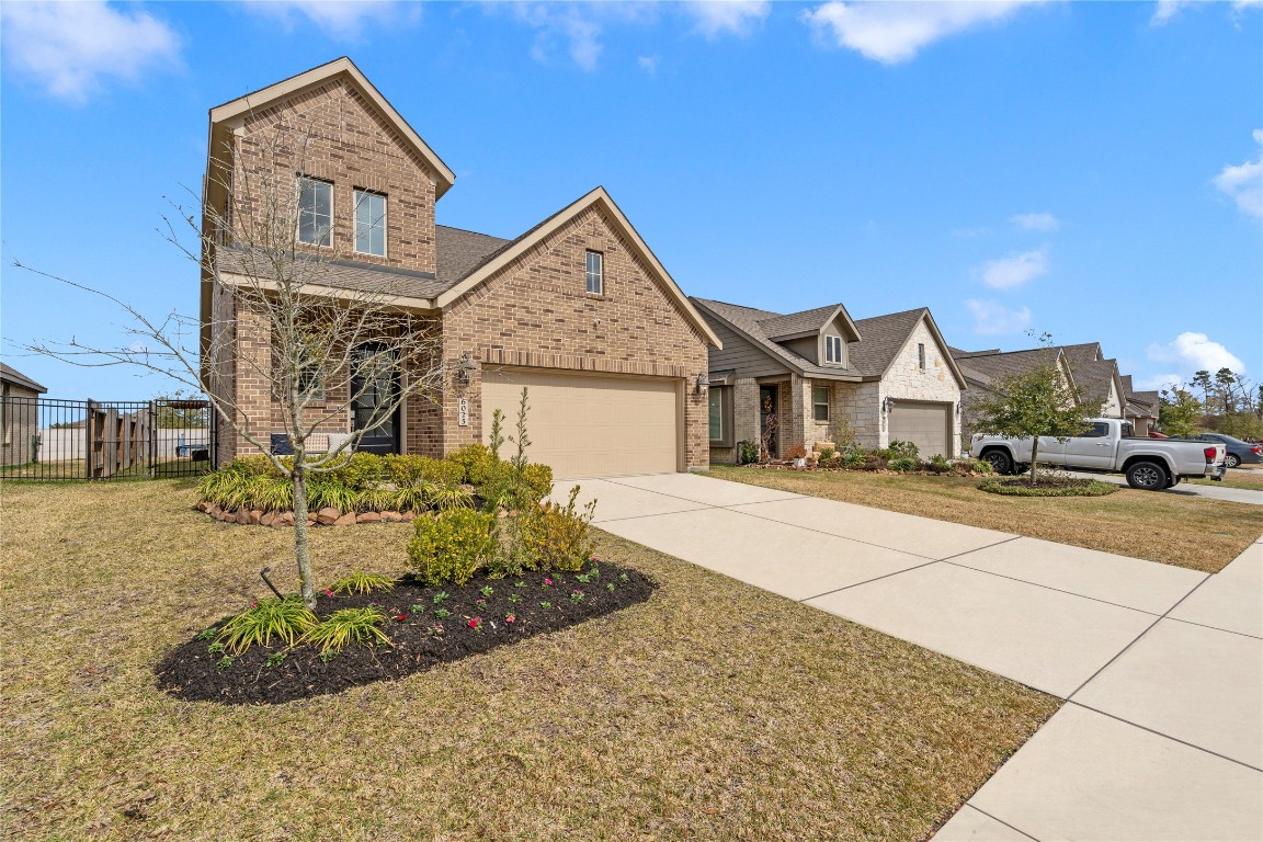6025 Windward Fls Way Porter, TX 77365 - Photo 4 of 35 a view of multiple houses with a yard