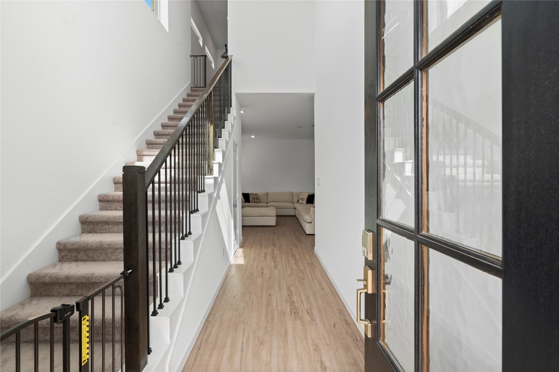 6025 Windward Fls Way Porter, TX 77365 - Photo 5 of 35 a view of a hallway with wooden floor and entryway