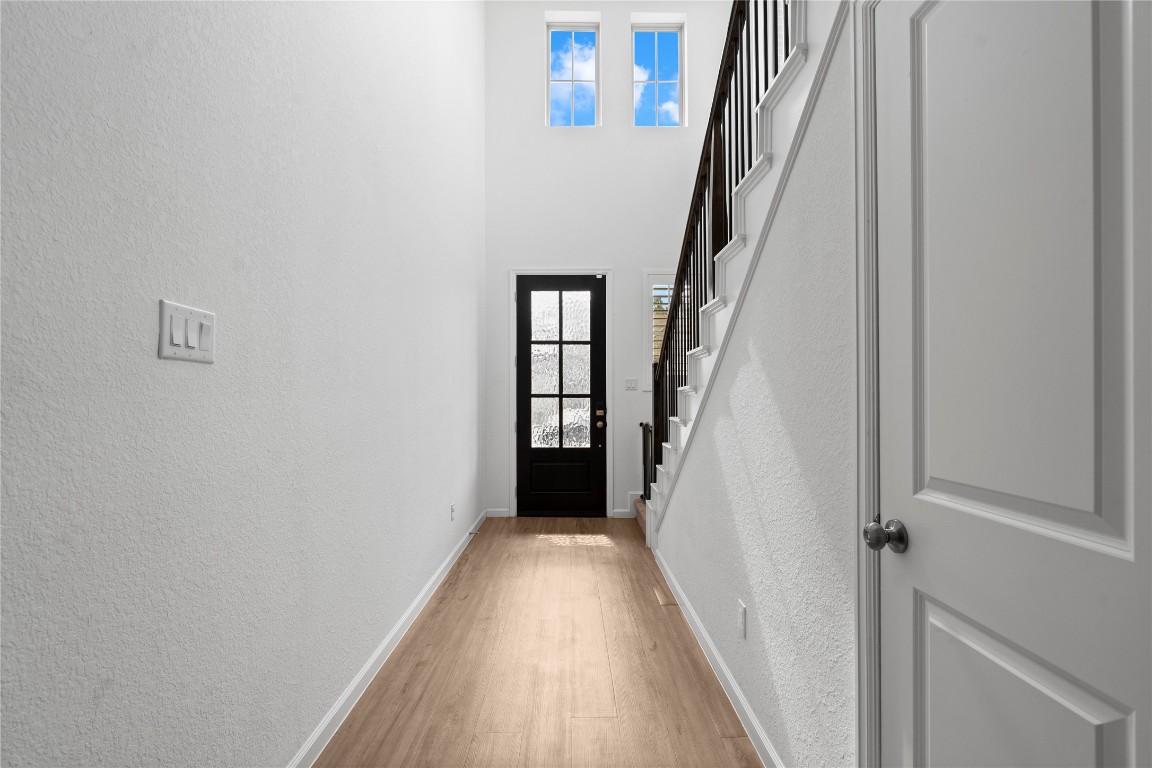 6025 Windward Fls Way Porter, TX 77365 - Photo 6 of 35 a view of a hallway with wooden floor and entryway