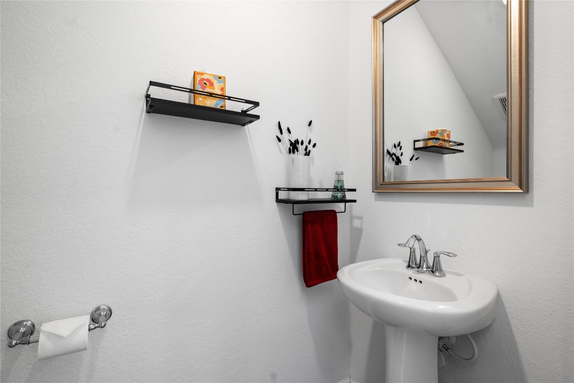 6025 Windward Fls Way Porter, TX 77365 - Photo 7 of 35 a bathroom with a sink and a mirror