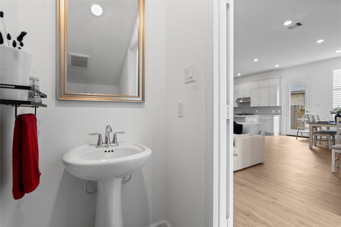 6025 Windward Fls Way Porter, TX 77365 - Photo 8 of 35 a bathroom with a sink and a mirror