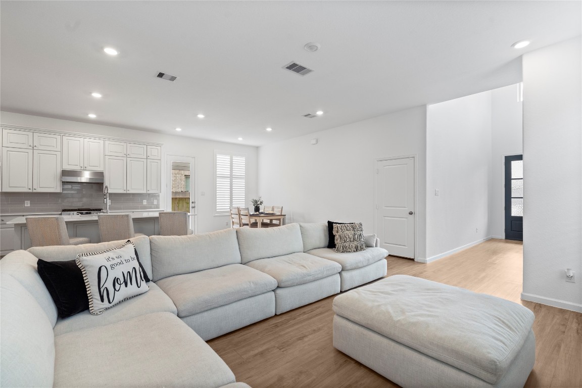 6025 Windward Fls Way Porter, TX 77365 - Photo 10 of 35 a living room with furniture white walls and white kitchen