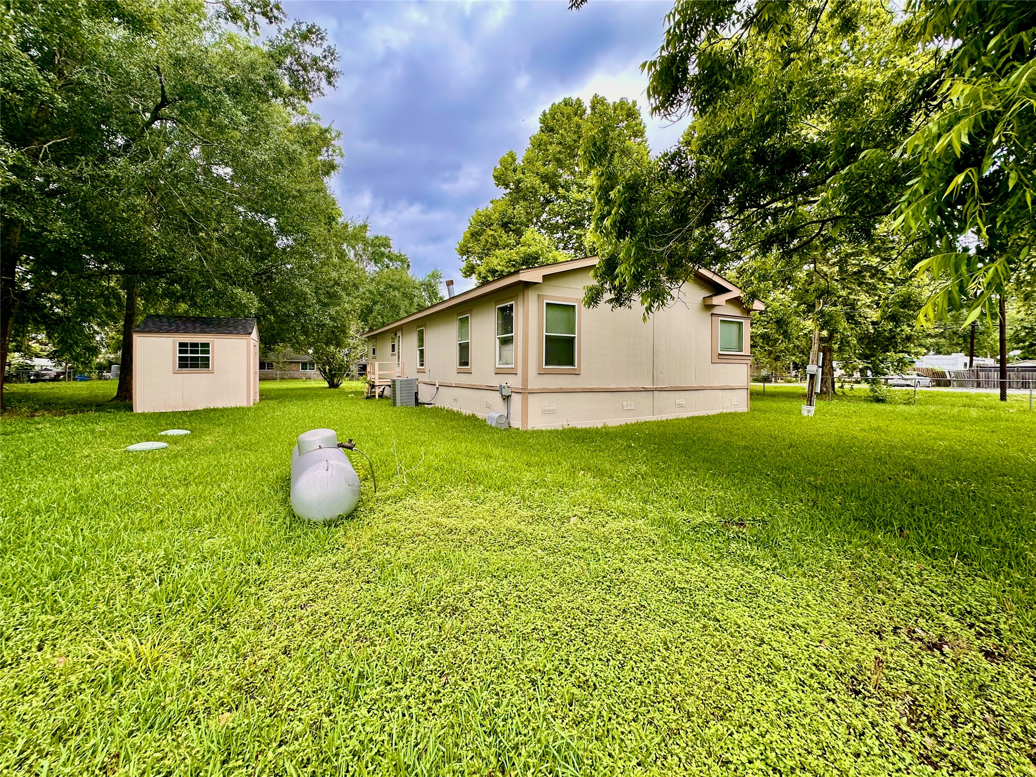 202 Main Street Fresno, TX 77545 - Photo 4 of 26 a view of a house with a backyard