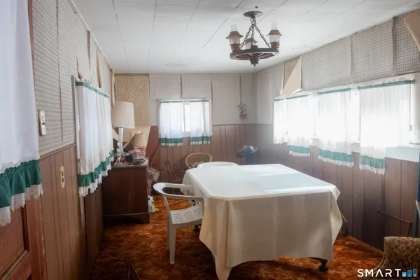 a room with furniture a window and a chandelier