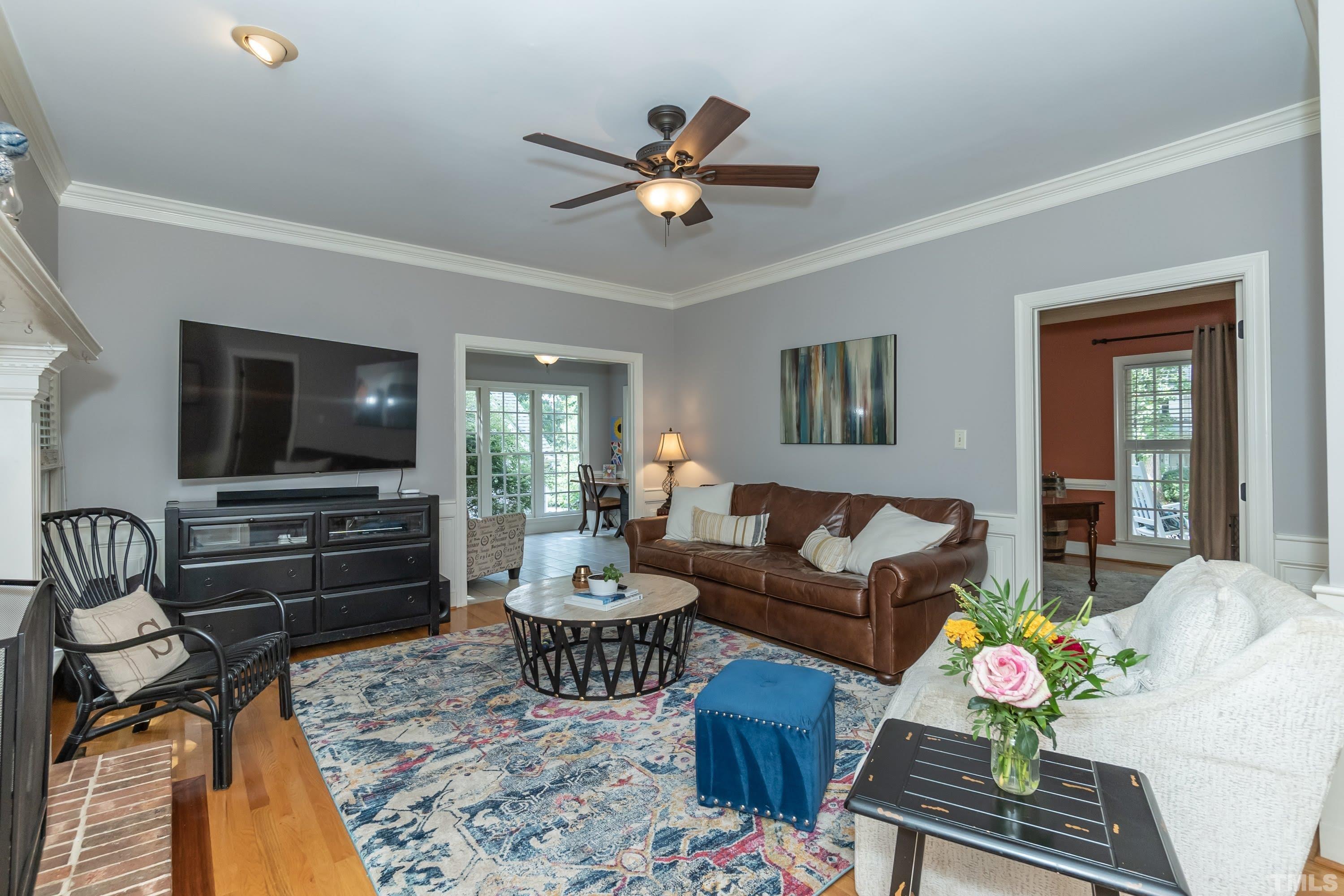 7904 Sandy Bottom Way Raleigh, NC 27613 - Photo 8 of 30 a living room with furniture and a flat screen tv