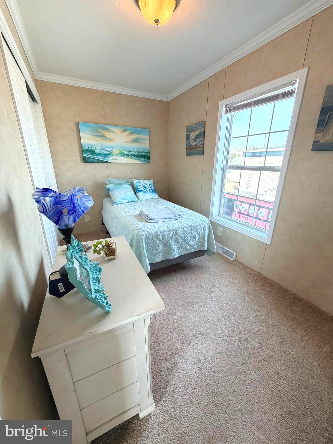 38025 Rabbit Road, Unit 101 Ocean View, DE 19970 - Photo 57 of 112 a bedroom with bed and a window