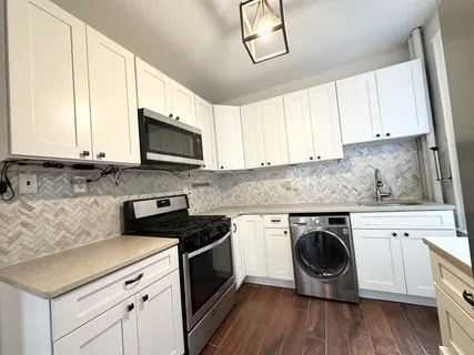 a kitchen with a stove and a microwave