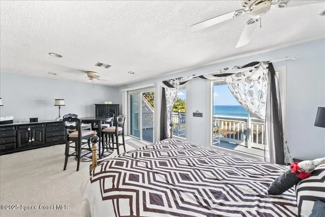 a view of dining room with wooden floor and entryway