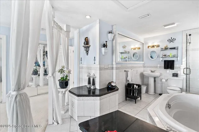 a view of a balcony with wooden floor & fence