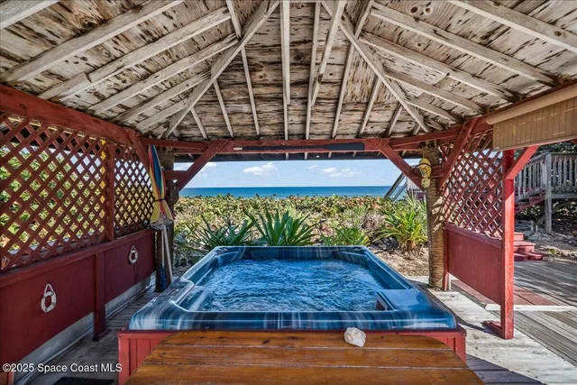 a view of a entryway with furniture and chandelier