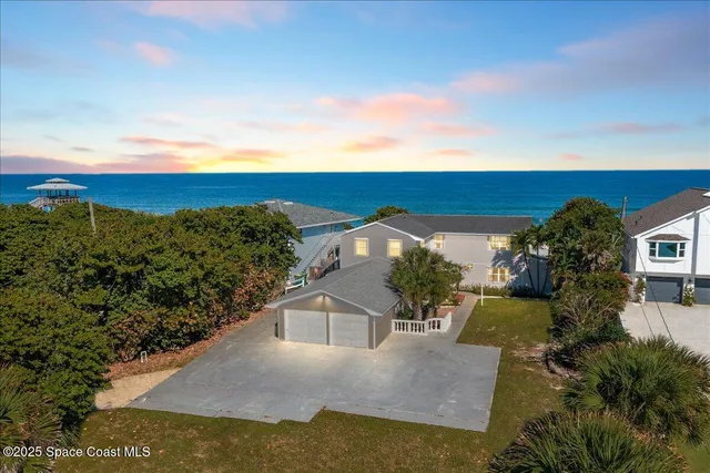 a utility room with cabinets washer and dryer