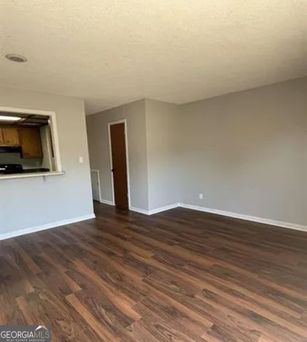 a view of a livingroom with wooden floor