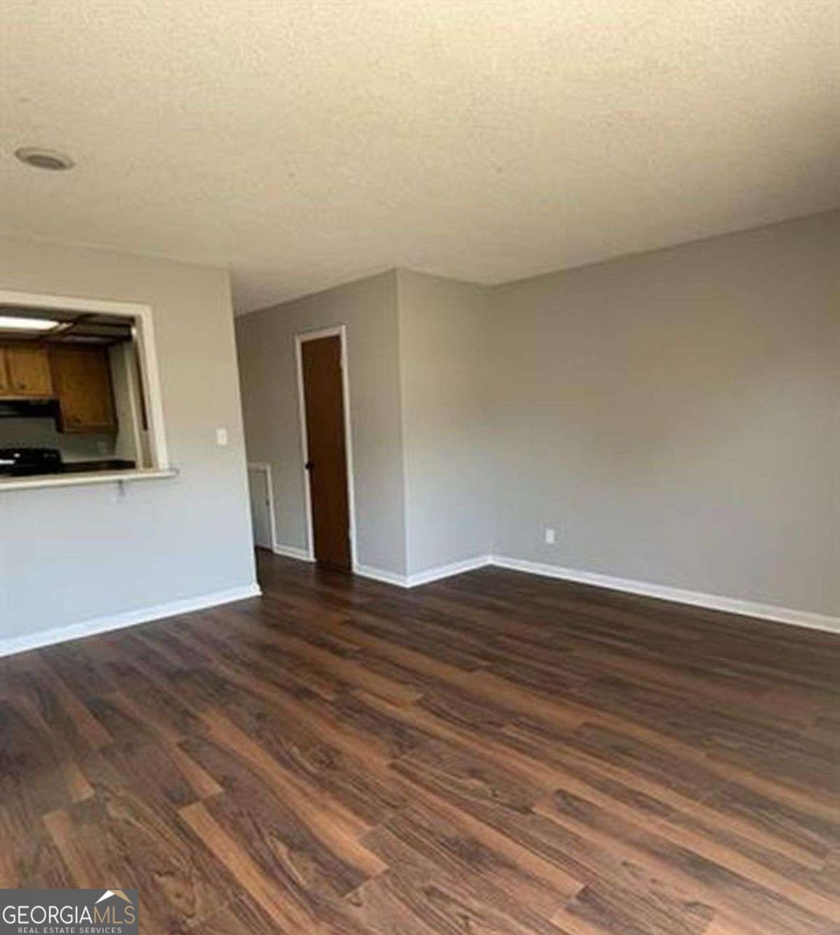 3730 Old Flowery Branch Road, Unit H3 Oakwood, GA 30566 - Photo 3 of 12 a view of a livingroom with wooden floor