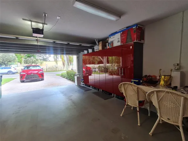 a view of a workspace with furniture and wooden floor