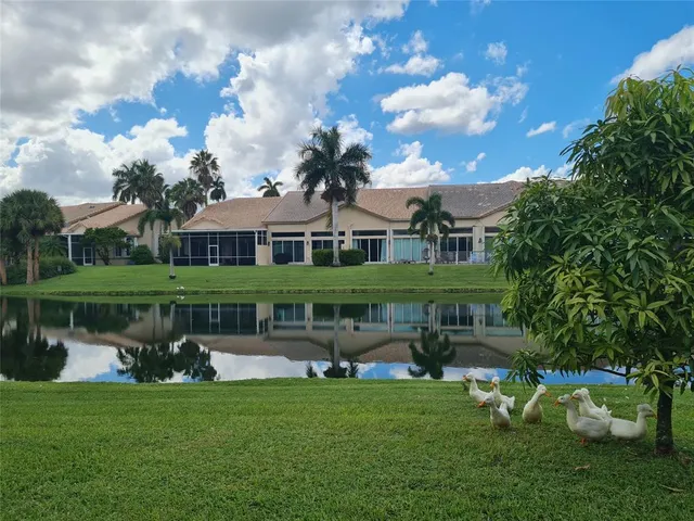 a view of house with a garden