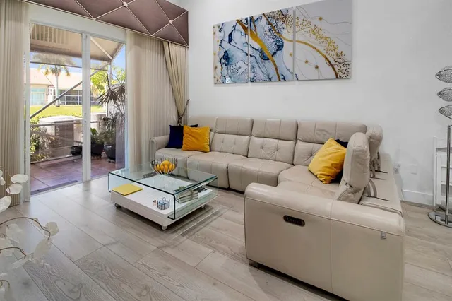 a living room with furniture and a table