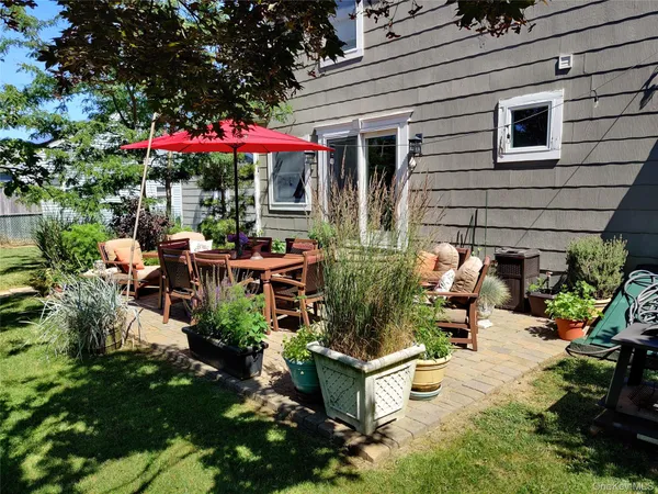 a view of a chairs and tables in patio of a house