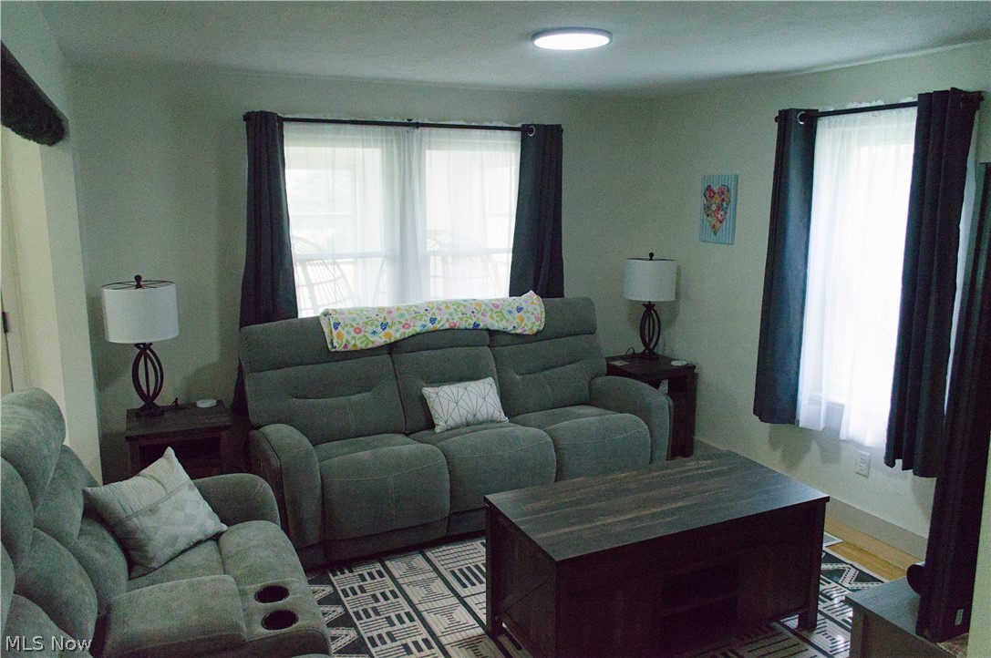 3187 Grenfall Road Barberton, OH 44203 - Photo 8 of 17 This inviting living area features light-colored walls, windows with sheer and blackout curtains, and a ceiling light fixture
